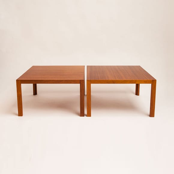 A pair of square coffee tables